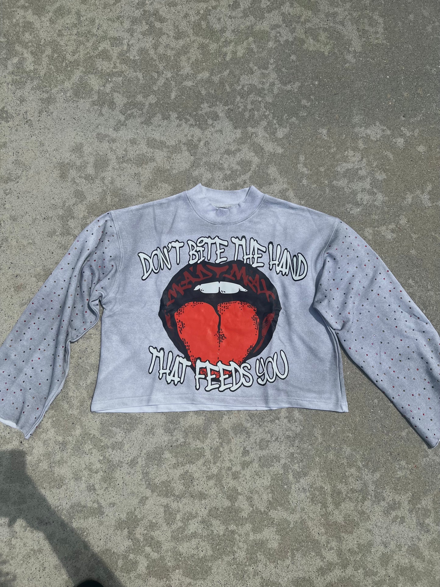 “DON’T BITE THE HAND THAT FEEDS YOU” SHIRT